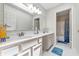 Bathroom featuring a double vanity, ample counter space, and bright lighting at 2463 Kettering Way, Indianapolis, IN 46214