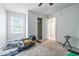Bright bedroom features a window and doorway leading to other spaces at 2463 Kettering Way, Indianapolis, IN 46214