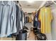 Walk-in closet with hanging clothes and multiple storage shelves at 2463 Kettering Way, Indianapolis, IN 46214