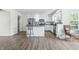 Kitchen area with island, stainless steel appliances, granite countertops and a chair in front of the island at 2463 Kettering Way, Indianapolis, IN 46214