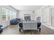 Spacious living room with laminate flooring, fireplace, and large windows providing ample natural light at 2463 Kettering Way, Indianapolis, IN 46214
