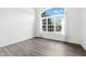 Bright living room featuring hardwood floors and a large window at 2463 Kettering Way, Indianapolis, IN 46214
