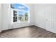 Bright living room featuring hardwood floors and a large window at 2463 Kettering Way, Indianapolis, IN 46214