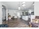 Open-concept living space with hardwood floors flows into kitchen, offering ample room for relaxation and entertainment at 2463 Kettering Way, Indianapolis, IN 46214