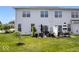 Well manicured backyard with lawn and patio furniture set on concrete pad at 2499 Blue Ridge Dr, Greenwood, IN 46143