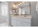Modern bathroom with double vanity, ample lighting, and a separate toilet room, blending convenience with style at 2499 Blue Ridge Dr, Greenwood, IN 46143