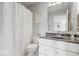 Bathroom with toilet and vanity with granite counters and framed mirror with shower and tub combination at 2499 Blue Ridge Dr, Greenwood, IN 46143
