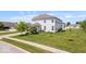 Exterior shot of home featuring lawn, mature landscaping and a side entry garage at 2499 Blue Ridge Dr, Greenwood, IN 46143