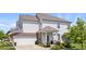 Charming two-story home with a well-manicured lawn, attached two-car garage, and inviting covered porch at 2499 Blue Ridge Dr, Greenwood, IN 46143
