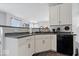 Modern kitchen featuring white cabinetry, black appliances, and functional layout with stylish finishes at 2499 Blue Ridge Dr, Greenwood, IN 46143