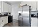 Well-lit kitchen featuring stainless steel appliances and dark countertops, blending style with functionality at 2499 Blue Ridge Dr, Greenwood, IN 46143