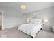 Bright bedroom showcasing a comfortable queen-size bed, soft lighting, and neutral décor for a relaxing ambiance at 2499 Blue Ridge Dr, Greenwood, IN 46143
