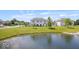 Exterior shot of home, rear elevation, overlooking a pond at 2499 Blue Ridge Dr, Greenwood, IN 46143