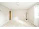 Spacious bedroom with neutral paint, plush carpet, and ample natural light from a window at 2613 W Queensbury Rd, Muncie, IN 47304