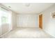 Bedroom featuring soft carpet, a window, and a closet with bi-fold doors, providing ample storage space at 2613 W Queensbury Rd, Muncie, IN 47304