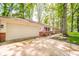 Single-story home with attached garage, flag, and walkway at 2613 W Queensbury Rd, Muncie, IN 47304