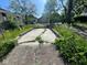 Driveway area with weeds growing through the concrete at 2625 E 12Th St, Indianapolis, IN 46201
