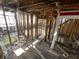 Stripped interior showing wooden framing, hardwood floors, and renovation potential at 2625 E 12Th St, Indianapolis, IN 46201