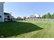 Spacious backyard with a screened porch, playground, and generous lawn area at 2734 Chalbury Dr, Plainfield, IN 46168