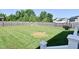 Expansive backyard featuring green grass and a sturdy wooden fence for privacy at 2734 Chalbury Dr, Plainfield, IN 46168