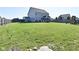 Extensive backyard featuring a lush lawn, a screened porch, and ample space for outdoor activities at 2734 Chalbury Dr, Plainfield, IN 46168