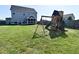 Spacious backyard with a play set, and a screened-in porch for outdoor relaxation at 2734 Chalbury Dr, Plainfield, IN 46168