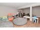 Finished basement area showcasing wood floors and a spacious area, perfect for recreation or entertaining at 2734 Chalbury Dr, Plainfield, IN 46168