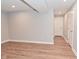 Finished basement shows the neutral paint, wood floors, trim and ceiling lighting at 2734 Chalbury Dr, Plainfield, IN 46168