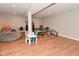 Finished basement featuring durable wood-look flooring and neutral paint throughout at 2734 Chalbury Dr, Plainfield, IN 46168