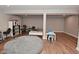 Basement with finished flooring shows the neutral walls and design to accommodate table and sitting area at 2734 Chalbury Dr, Plainfield, IN 46168