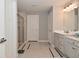 Bathroom featuring a double sink vanity, a glass shower, and tile floors at 2734 Chalbury Dr, Plainfield, IN 46168