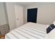 This bedroom showcases the closet, neutral paint, and a window with blue curtain at 2734 Chalbury Dr, Plainfield, IN 46168