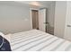 Bedroom features a door, closet, window with curtain, neutral paint and wood floors at 2734 Chalbury Dr, Plainfield, IN 46168