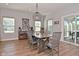 Well-lit dining area showcasing wood floors, a coffee bar, and sliding glass doors to the outdoors at 2734 Chalbury Dr, Plainfield, IN 46168