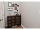 Entryway with a 12 drawer cabinet and decor, including dog themed decorations at 2734 Chalbury Dr, Plainfield, IN 46168