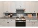 Elegant kitchen with granite counters, modern appliances, stylish backsplash, and ample storage space at 2734 Chalbury Dr, Plainfield, IN 46168