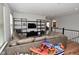 Cozy living room with comfortable leather couch and shelving at 2734 Chalbury Dr, Plainfield, IN 46168