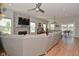 Cozy living room with a stone fireplace, hardwood floors, and ample seating at 2734 Chalbury Dr, Plainfield, IN 46168
