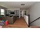 Living room with a leather couch and a black bookshelf with tv at 2734 Chalbury Dr, Plainfield, IN 46168