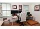 Well lit home office space features multiple monitors and windows at 2734 Chalbury Dr, Plainfield, IN 46168