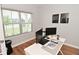 Bright office space with a large window and modern desk setup at 2734 Chalbury Dr, Plainfield, IN 46168