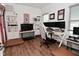 This home office is bathed in sunlight and has hard surface flooring and ample shelving at 2734 Chalbury Dr, Plainfield, IN 46168