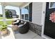 Inviting front porch with comfortable seating and stylish decor at 2734 Chalbury Dr, Plainfield, IN 46168