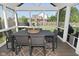 Relaxing screened porch with outdoor dining table and view of the backyard at 2734 Chalbury Dr, Plainfield, IN 46168