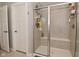 Bathroom shower with glass door, shelving, and seating inside at 2734 Chalbury Dr, Plainfield, IN 46168
