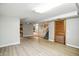 Spacious basement area with light gray walls, a wooden door and modern flooring at 2811 Beech Dr, Columbus, IN 47203
