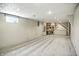 Spacious basement featuring carpeting, recessed lighting, and built-in shelving and desk area at 2811 Beech Dr, Columbus, IN 47203
