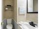Powder bathroom featuring a framed mirror, modern black faucet, and wall decorations at 2811 Beech Dr, Columbus, IN 47203