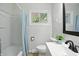 Clean bathroom with updated sink and a shower-tub combo at 2811 Beech Dr, Columbus, IN 47203