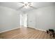 Bedroom featuring wood-look flooring, a ceiling fan, and closet space at 2811 Beech Dr, Columbus, IN 47203